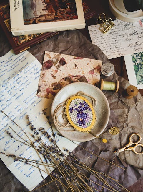 pexels-photo-8567755-8567755 A rustic scene featuring embroidery, dried lavender, vintage letters, and sewing materials.